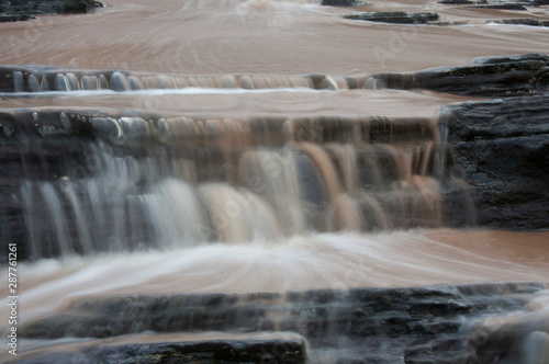 Dirty water flowing from storm water drains into the sea South Africa