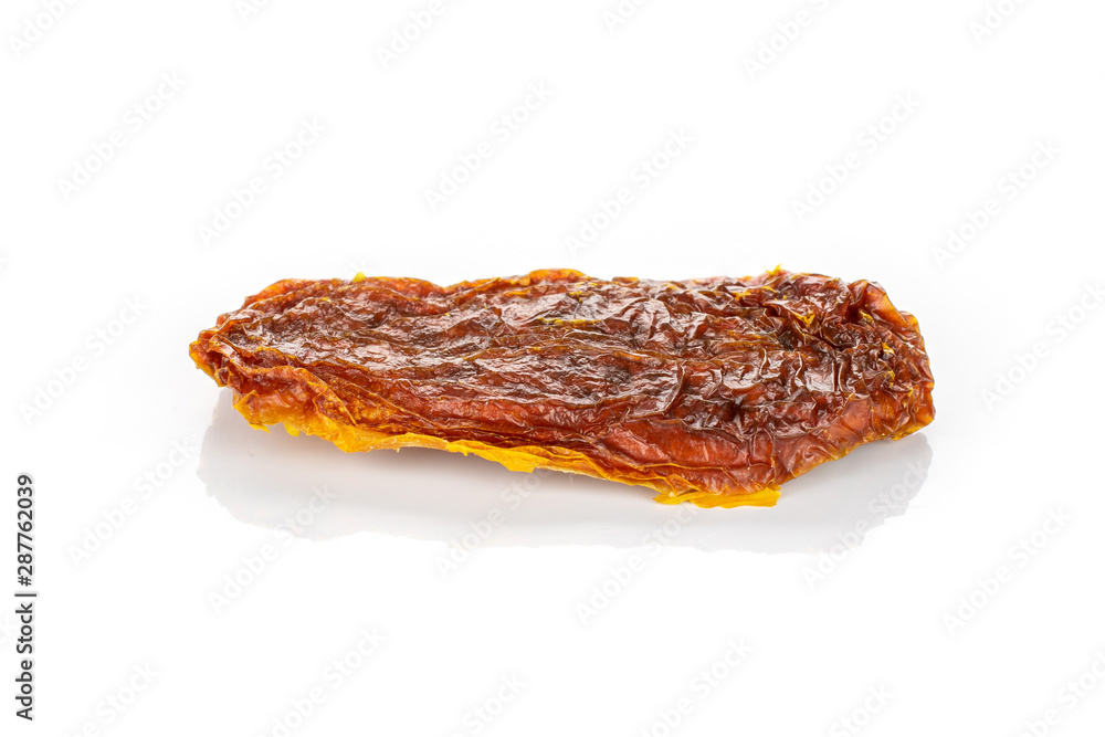 One whole dried red tomato isolated on white background One whole dried red tomato isolated on white background