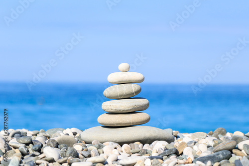 pyramid of  stones on background of sea  balance  Zen  peace  background.