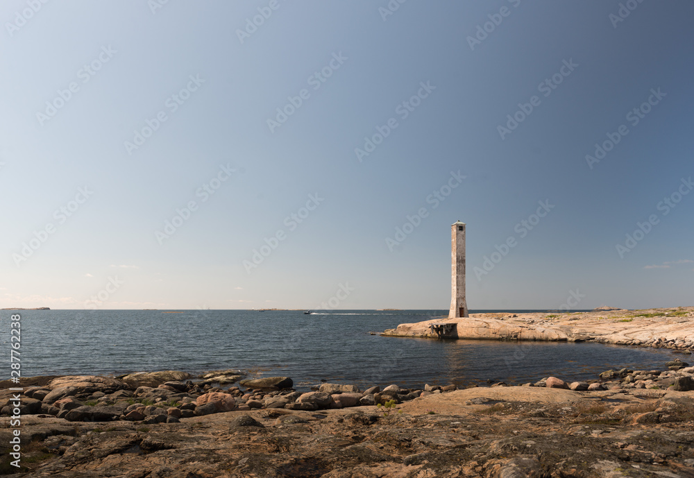 Fototapeta premium Abandoned lighthouse on a flat island.