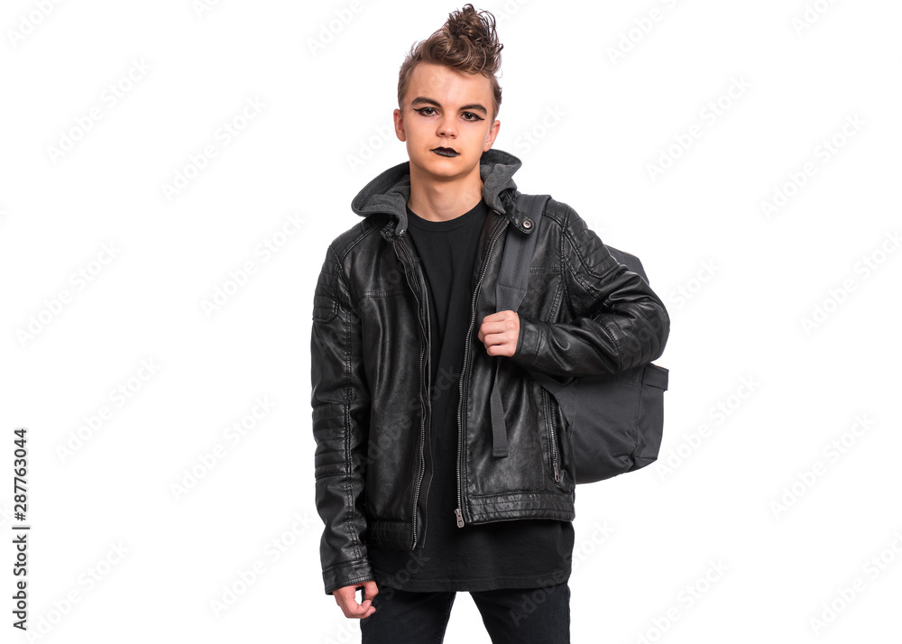 Portrait of teen boy student with spooking make-up holds bag, isolated on white background. Teenager with backpack in style of punk goth dressed in black. Problems of transitional age. Portrait of teen boy student with spooking make-up holds bag, isolated on white background. Teenager with backpack in style of punk goth dressed in black. Problems of transitional age.