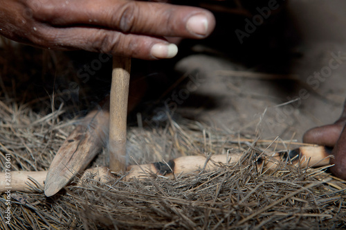 Bushman making fire in Africa