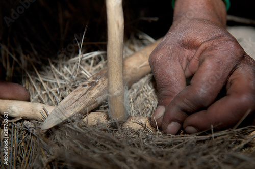 Bushman making fire in Africa