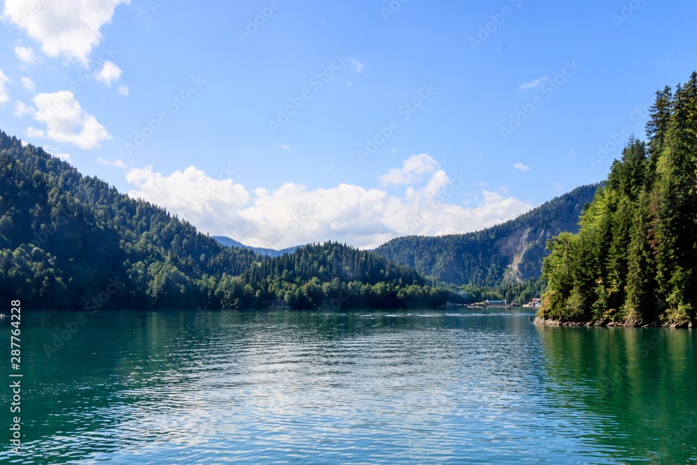 beautiful view mountain lake and mountains covered with forest.