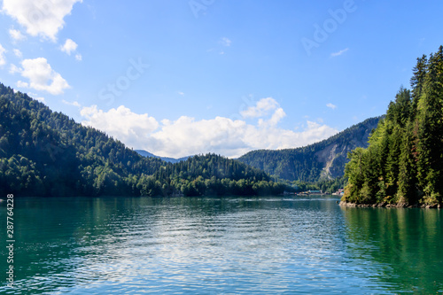 beautiful view mountain lake and mountains covered with forest.
