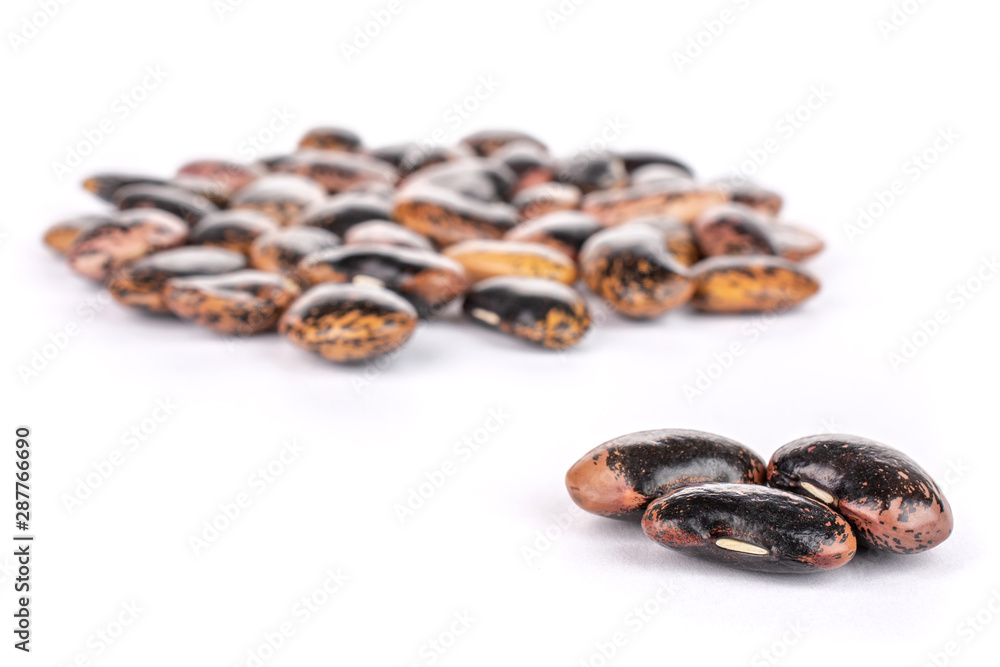 Lot of whole stained purple bean isolated on white background Lot of whole stained purple bean isolated on white background