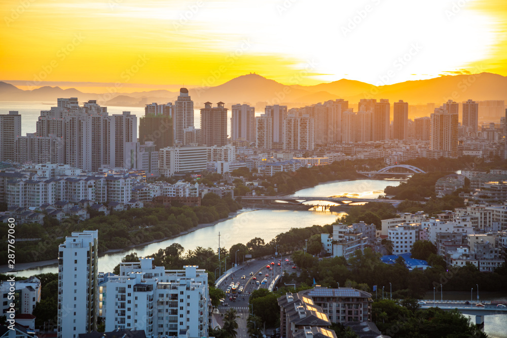 Aerial view of Sanya city with river at sunset light, Hainan province, China