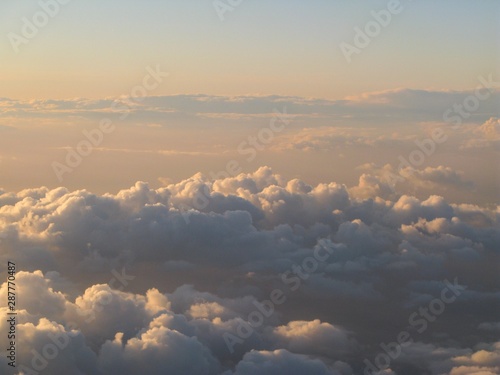 Beautiful and dreamy Clouds and Cloud Formations photographed from above during sunset   dawn