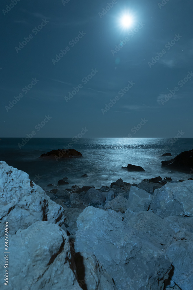 Moon above beautiful crystalline water