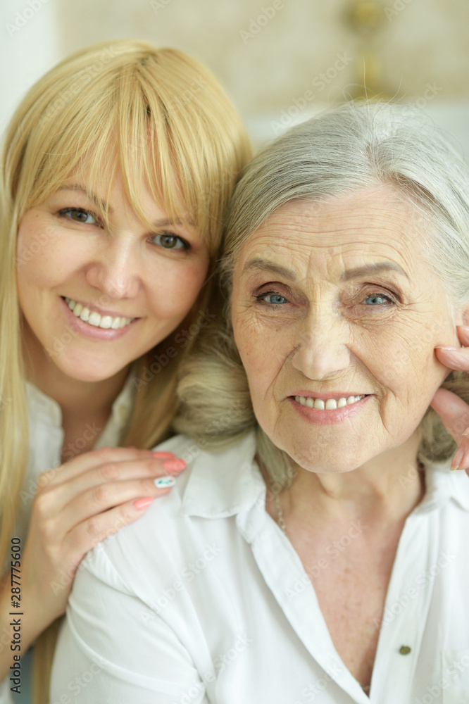 Portrait of senior woman with daughter at home Portrait of senior woman with daughter at home