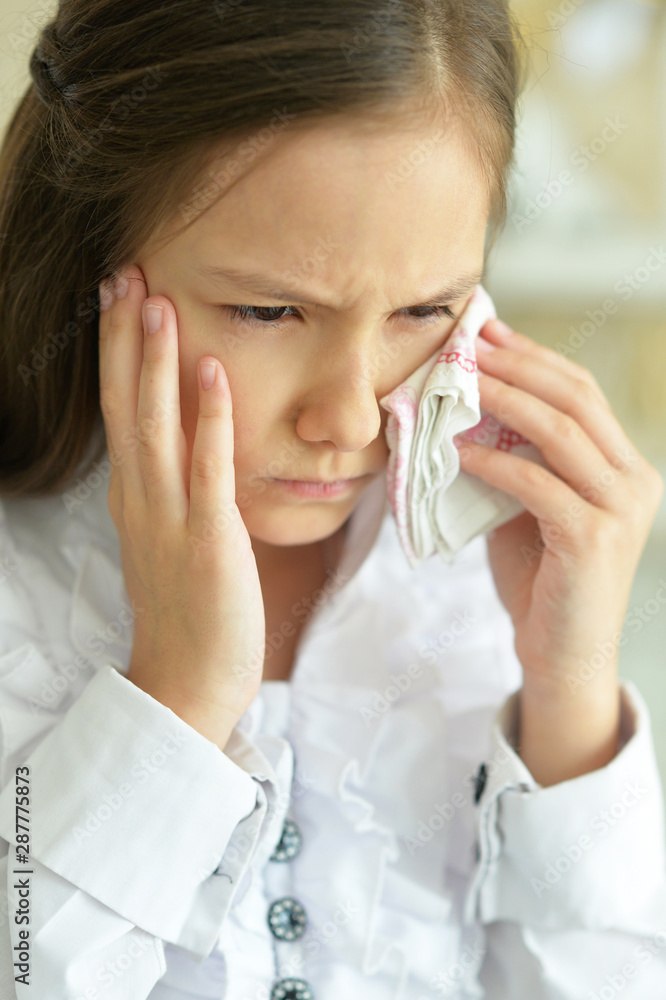 Portrait of sick little girl holding handkerchief Portrait of sick little girl holding handkerchief