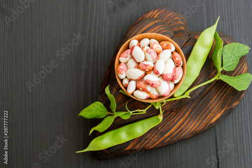 Anasazi beans. close up. on black background. photo