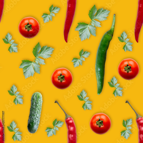 Seamless pattern with cucumber, tomato, parsley  and red  hot pepper. Vegetables abstract background. Cucumber the white background.