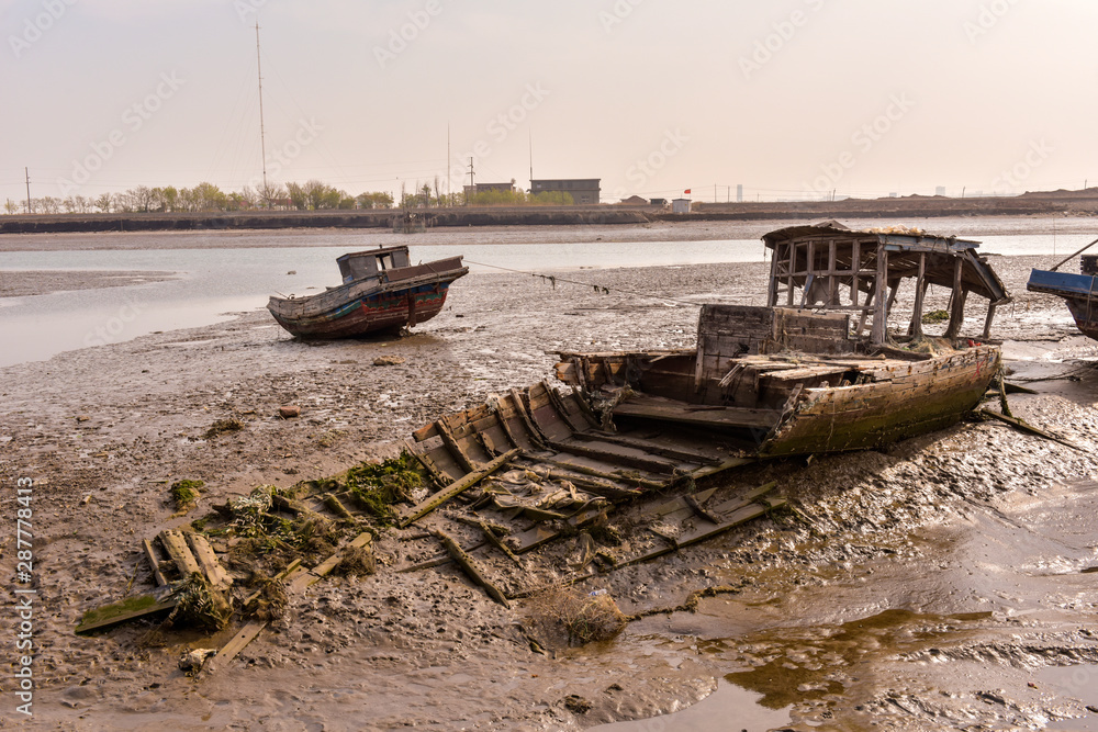 An old ship docked at the sea