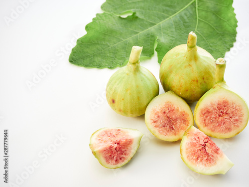 Figs fruit with leaves on white background