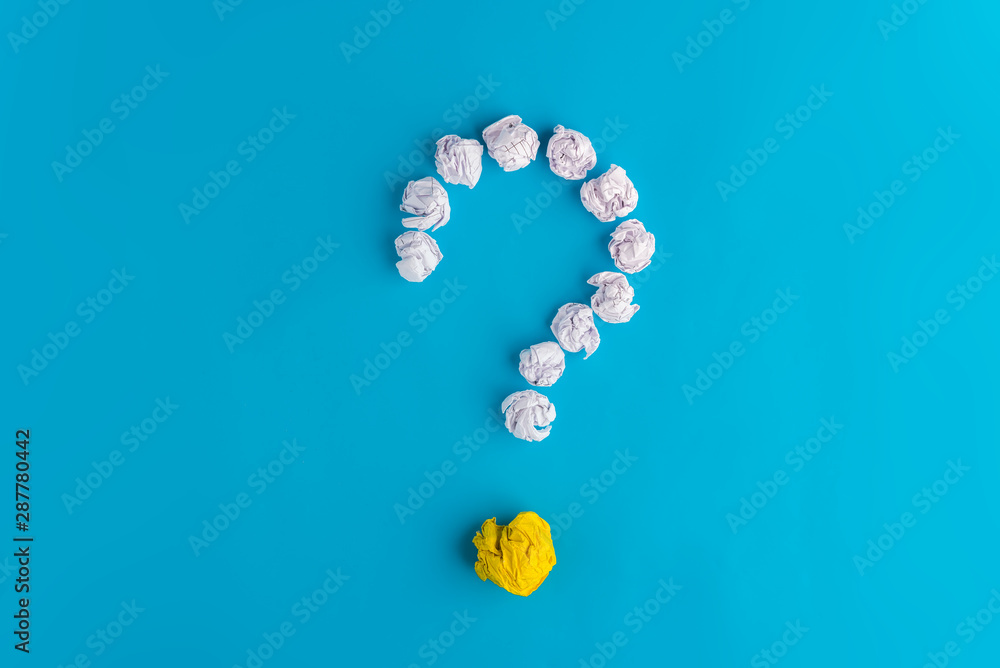 Question mark of crumpled pieces of paper on a blue background,search Question mark of crumpled pieces of paper on a blue background,search