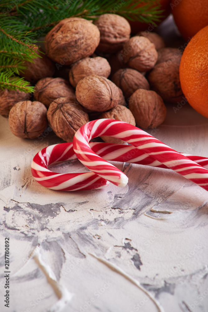 Chocolate, orange and nuts on table on white background. concept of new year Chocolate, orange and nuts on table on white background. concept of new year