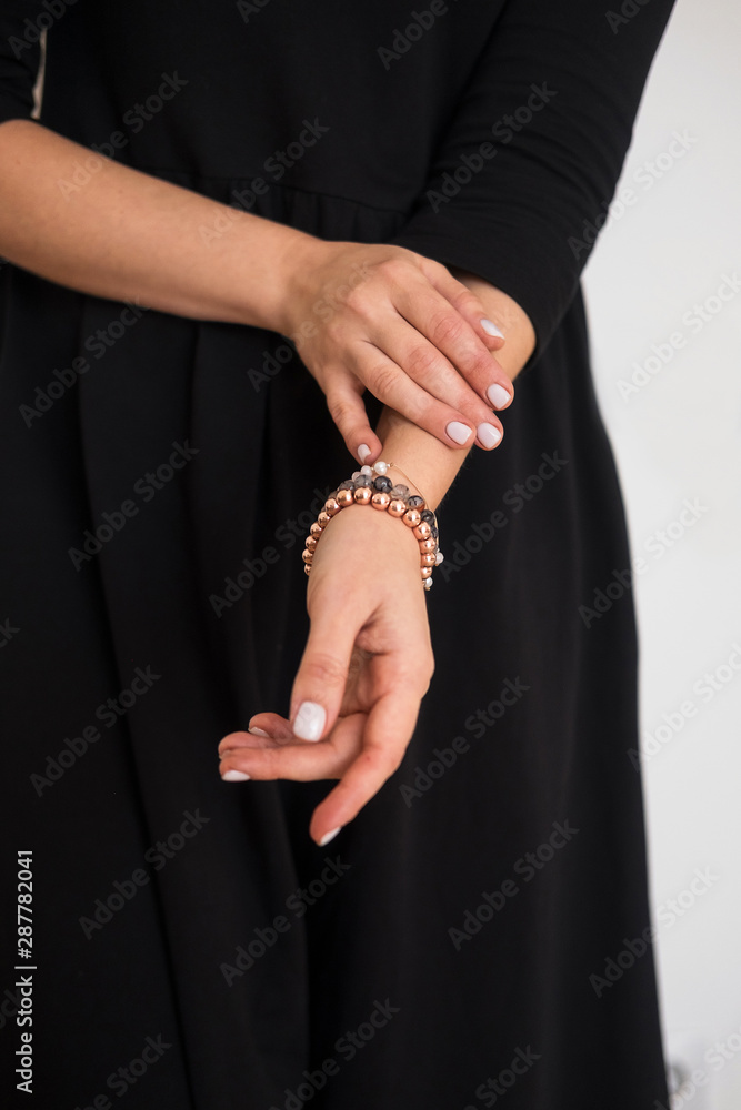 Woman's hands closeup with white gel nail polish. Beauty salon, blogging concept