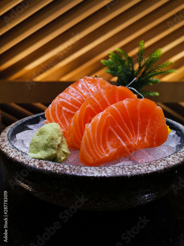 Fresh salmon sashimi serve with wasabi and ice