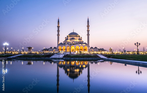 Beautiful Mosque in the world Largest Mosque in Sharjah traditional Islamic architecture new tourist attraction in Middle East evening shot of New Sharjah Mosque 