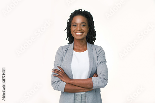 Confident Business Girl Smiling At Camera Crossing Hands, White Background