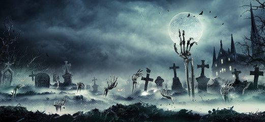 Skeleton Zombie Hand Rising Out Of A GraveYard - Halloween