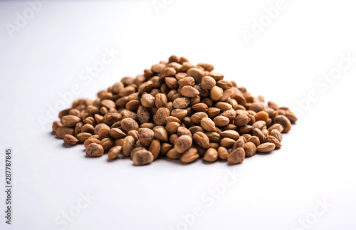 Indian charoly / Buchanania lanzan / Almondette kernel seeds in a bowl or pile. selective focus