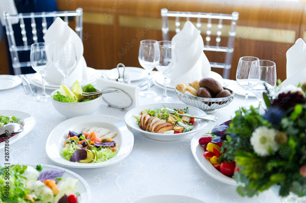 salads on a white table in a restaurant