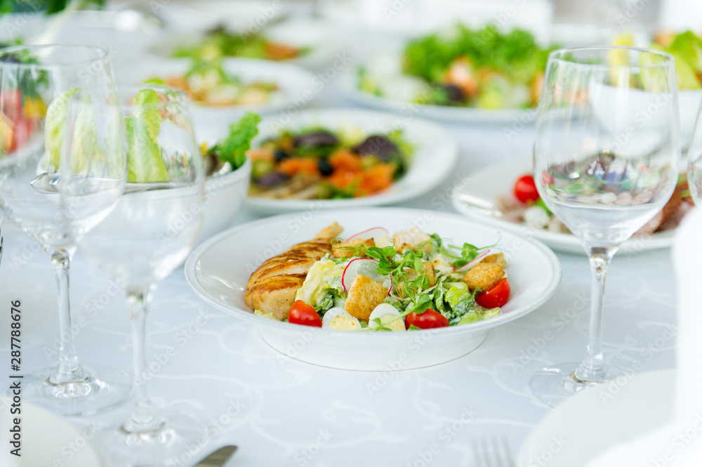 salad on a white table in a restaurant salad on a white table in a restaurant