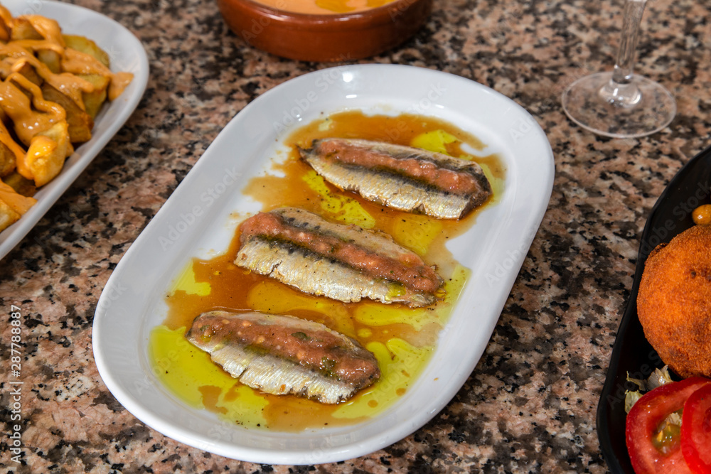 sardine top with sauce, typical Spanish sardine top with sauce, typical Spanish