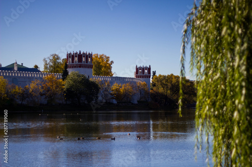 The pond in the Park of Novodevichy monastery on the background of blue sky in the autumn. Beautiful landscape in the Park Novodevichy ponds.