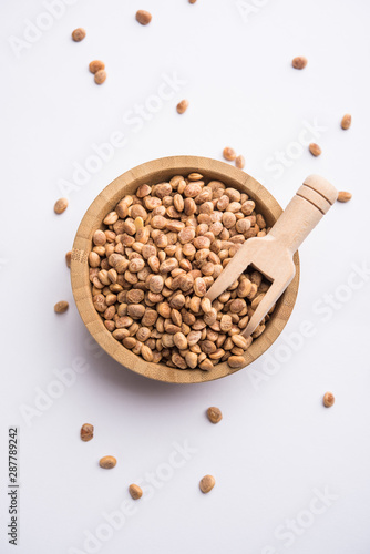 Indian charoly / Buchanania lanzan / Almondette kernel seeds in a bowl or pile. selective focus photo