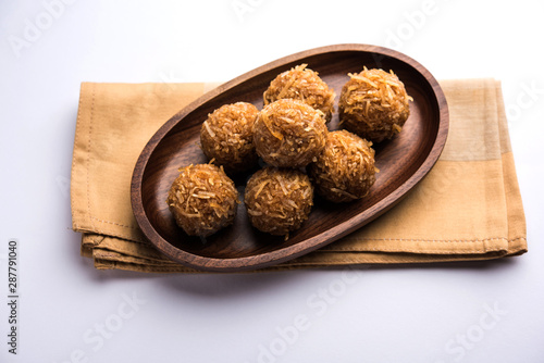 Jaggery coconut Laddoo / Nariyal gur ke laddu, indian sweet food for festivals like rakshabandhan/rakhi pournima photo