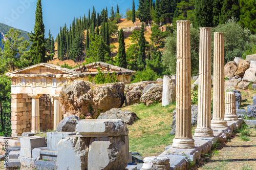 Ancient city of Delphi with ruins of the temple of Apollo, the omfalos (center) of the earth, theater, arena and other buildings, Greece photo