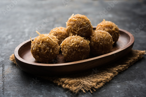 Jaggery coconut Laddoo / Nariyal gur ke laddu, indian sweet food for festivals like rakshabandhan/rakhi pournima photo