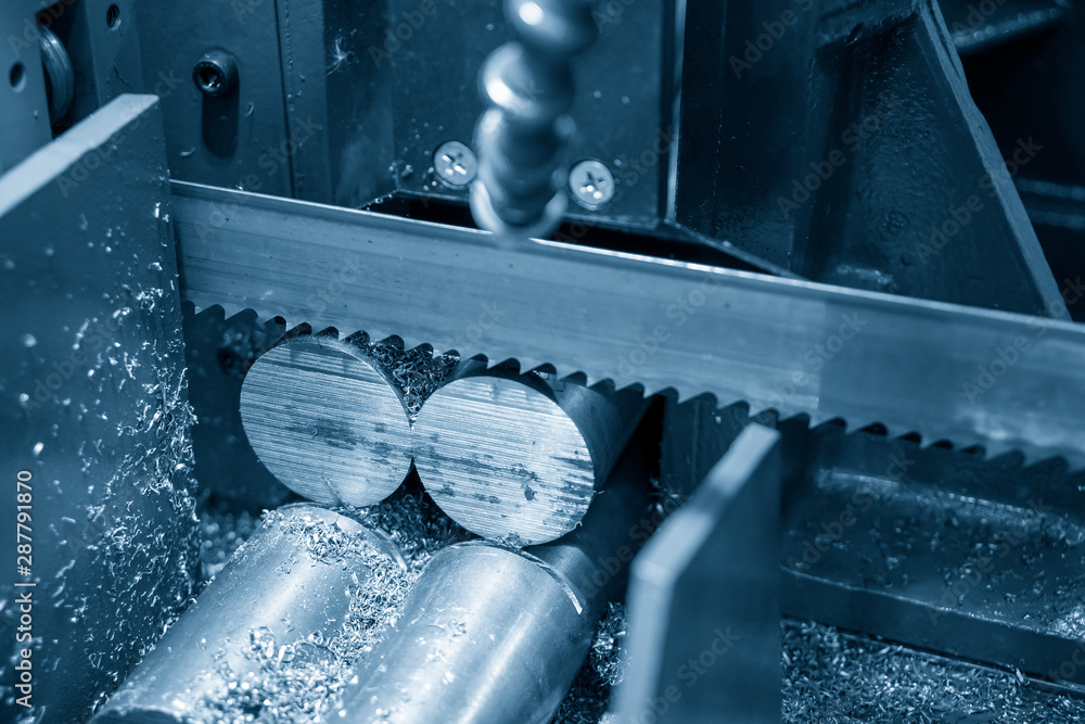The operation of band saw machine cutting the metal rod. The ingot material  preparation for machining process by automatic band saw machine. Stock  Photo | Adobe Stock