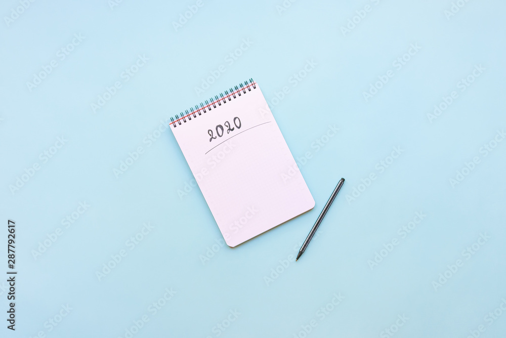 Top view of empty notebook ready for New 2020 Year planing or wish list Top view of empty notebook ready for New 2020 Year planing or wish list