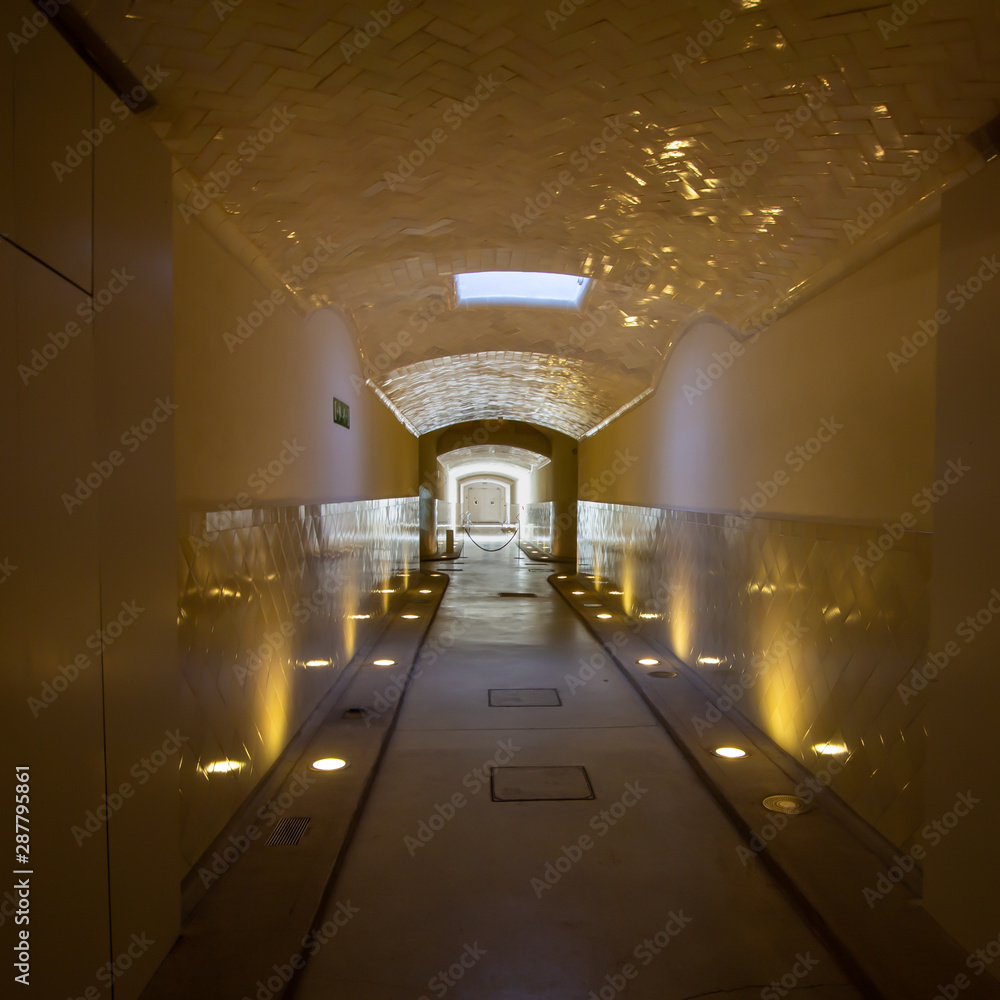 Naklejka premium Dramatically lit tunnel below Hospital de la Santa Creu i Sant Pau