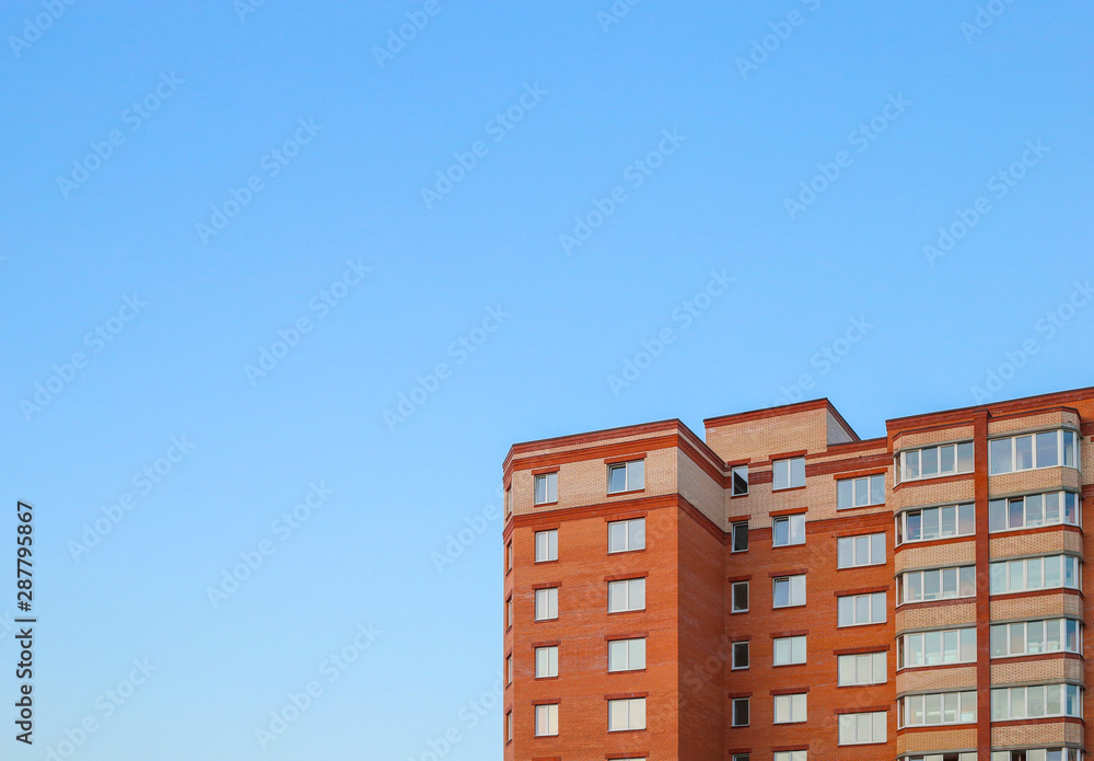 residential building against the sky. Building. New buildings. Red brick. Copy space for text
