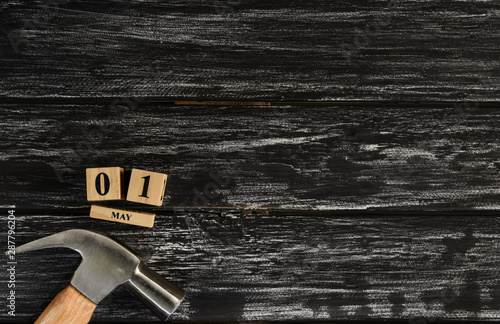 Top view of handy tools on black wooden background with copy space for your text for Worker's day, Labor's day, labour's day background.