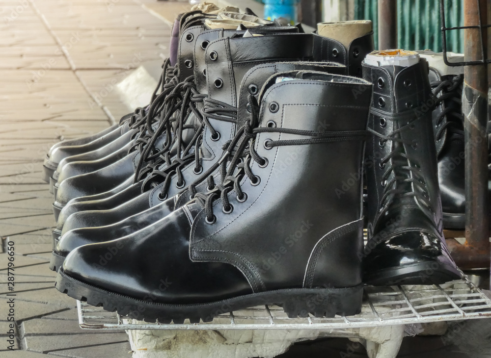 Men's leather Shoes or Black Leather Military Army Boots in Row. Stock  Photo | Adobe Stock