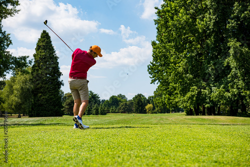 Photography Close up Golfer is driving golf ball to green course