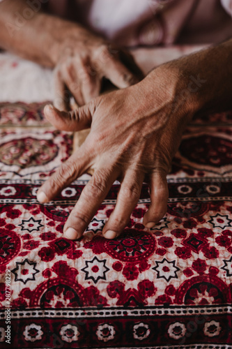 Closeup of Hand colouring pattern on cloth 