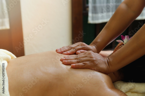 close-up masseur hands doing back massage in spa salon. Beauty treatment concept.