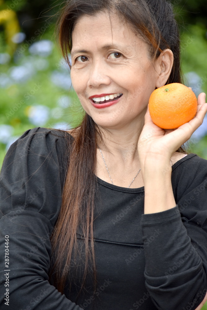 Happy Older Asian Female Senior With Fruit Happy Older Asian Female Senior With Fruit