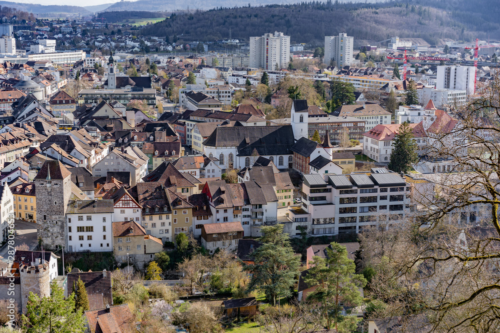City view over black tower and the picturesque old town of Brugg. Aerial panoramic view.
