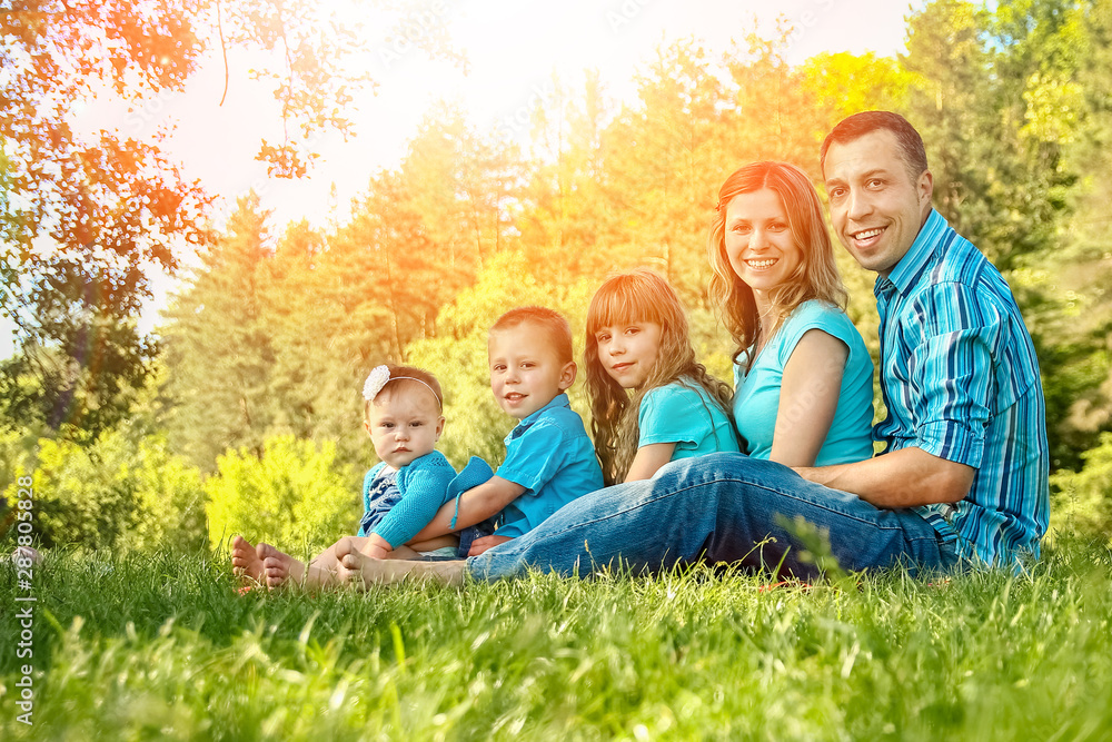 Fototapeta premium happy family outdoors in the park