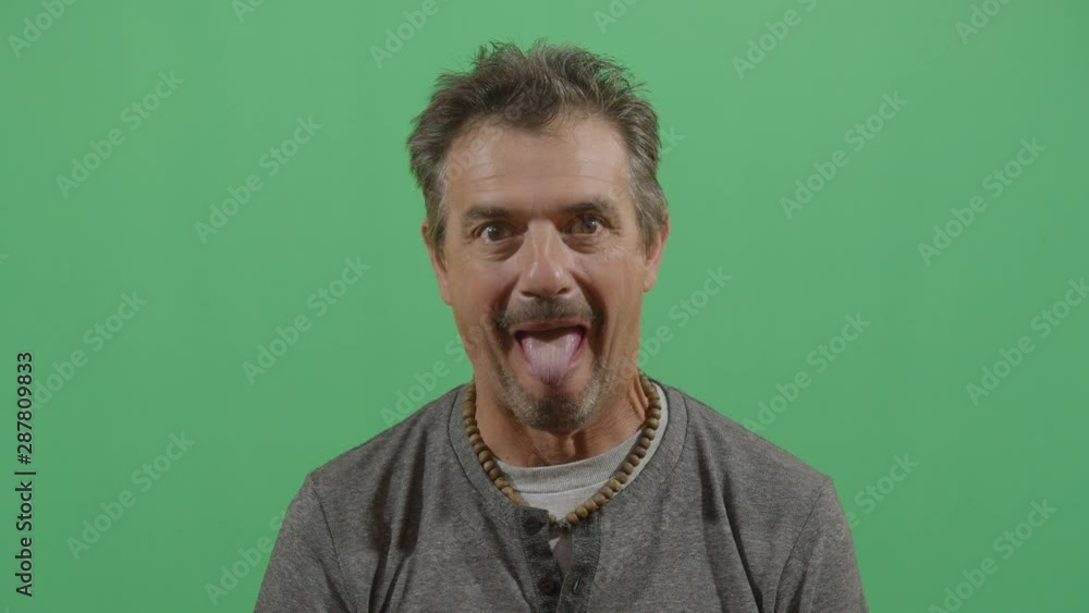 Adult Man Sticking Out Tongue To The Viewer Adult Man Sticking Out Tongue To The Viewer