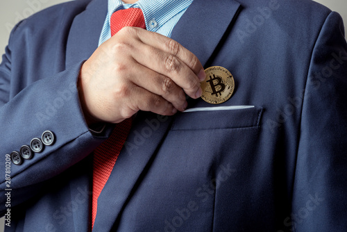 businessman pick up bitcoin digital currency from pocket