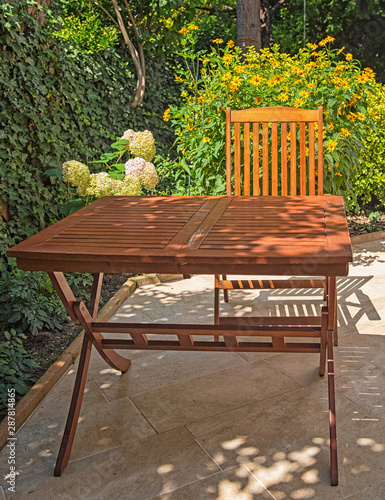 Wooden table with a sheet o...